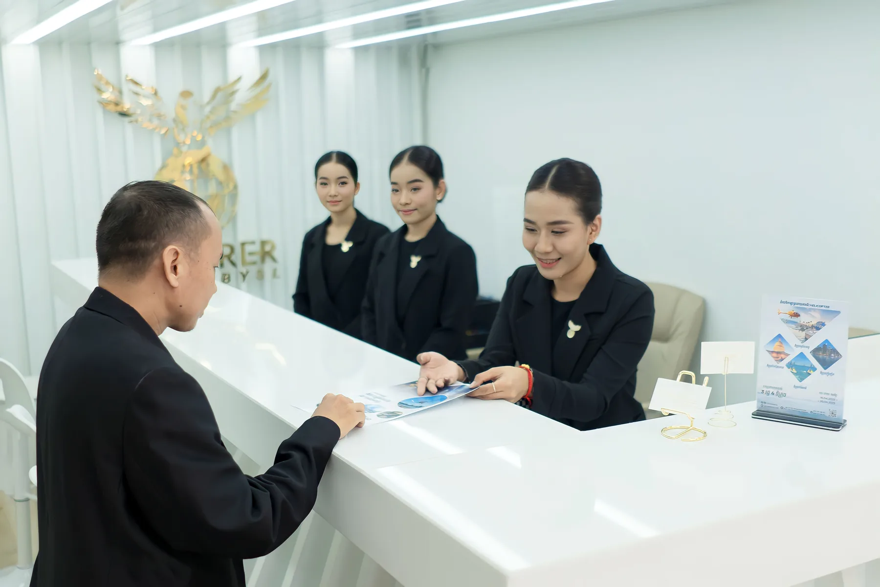 Agency staff assisting a client with travel plans